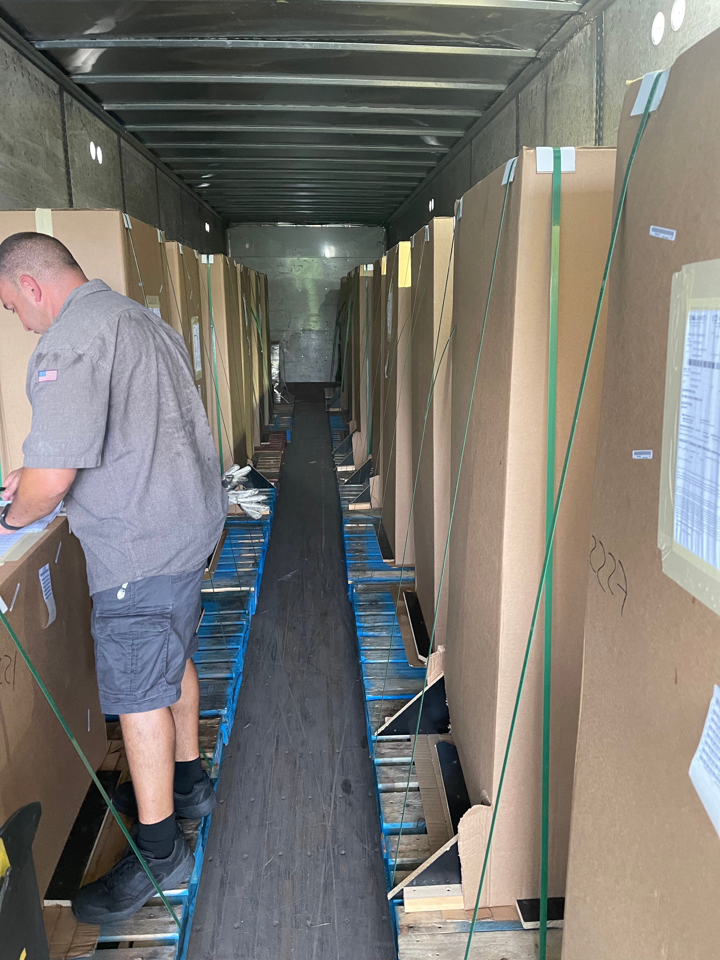Palletized arcade cabinets inside a freight trailer