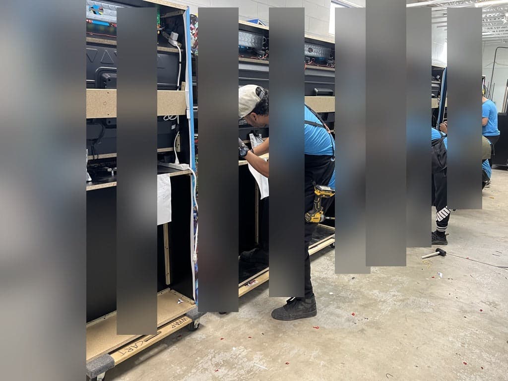 Arcade cabinets being assembled in the Quality Arcades workshop